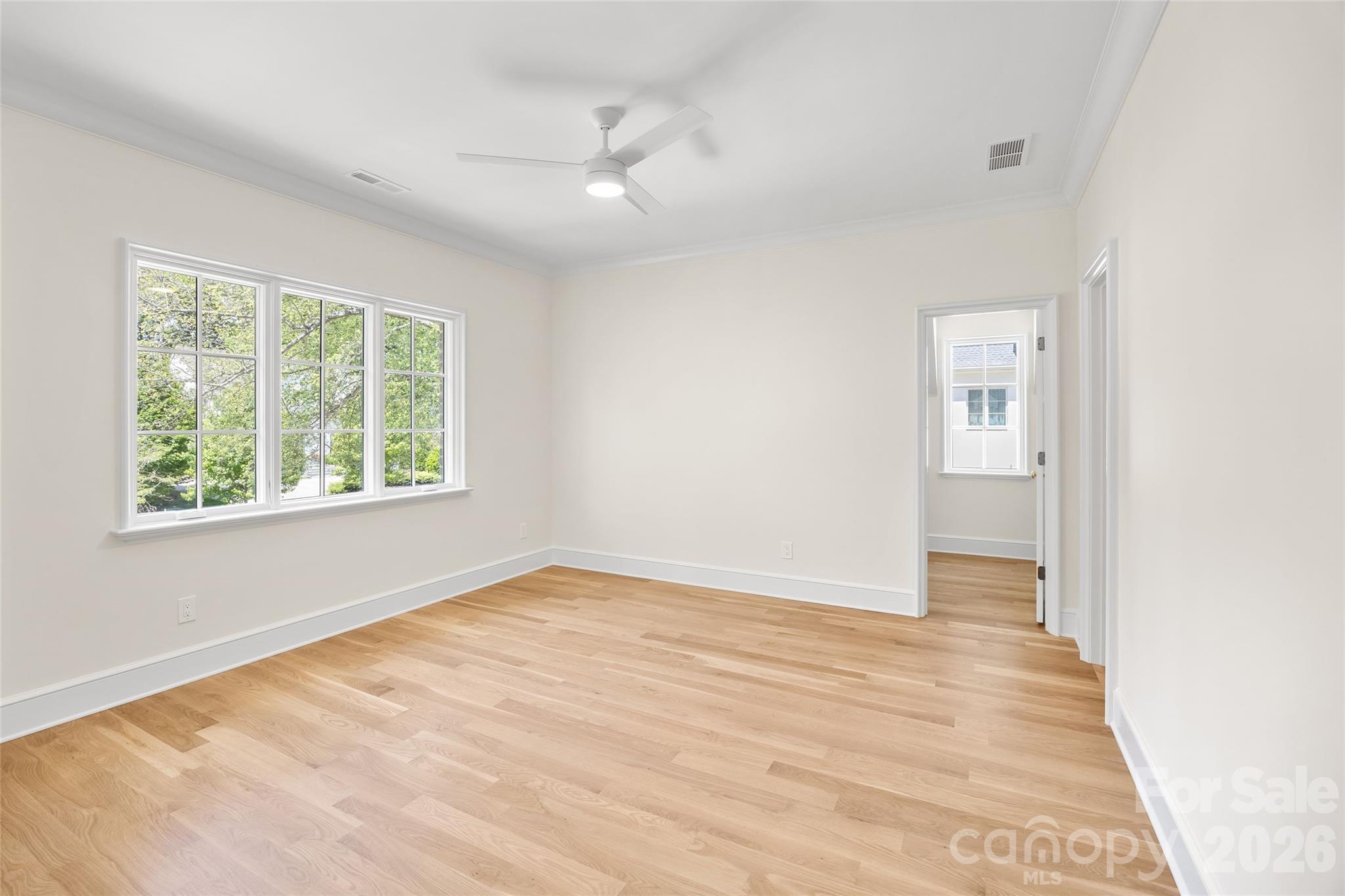 1615 Coventry Road Charlotte, NC 28211 - Photo 35 of 48 an empty room with wooden floor and windows