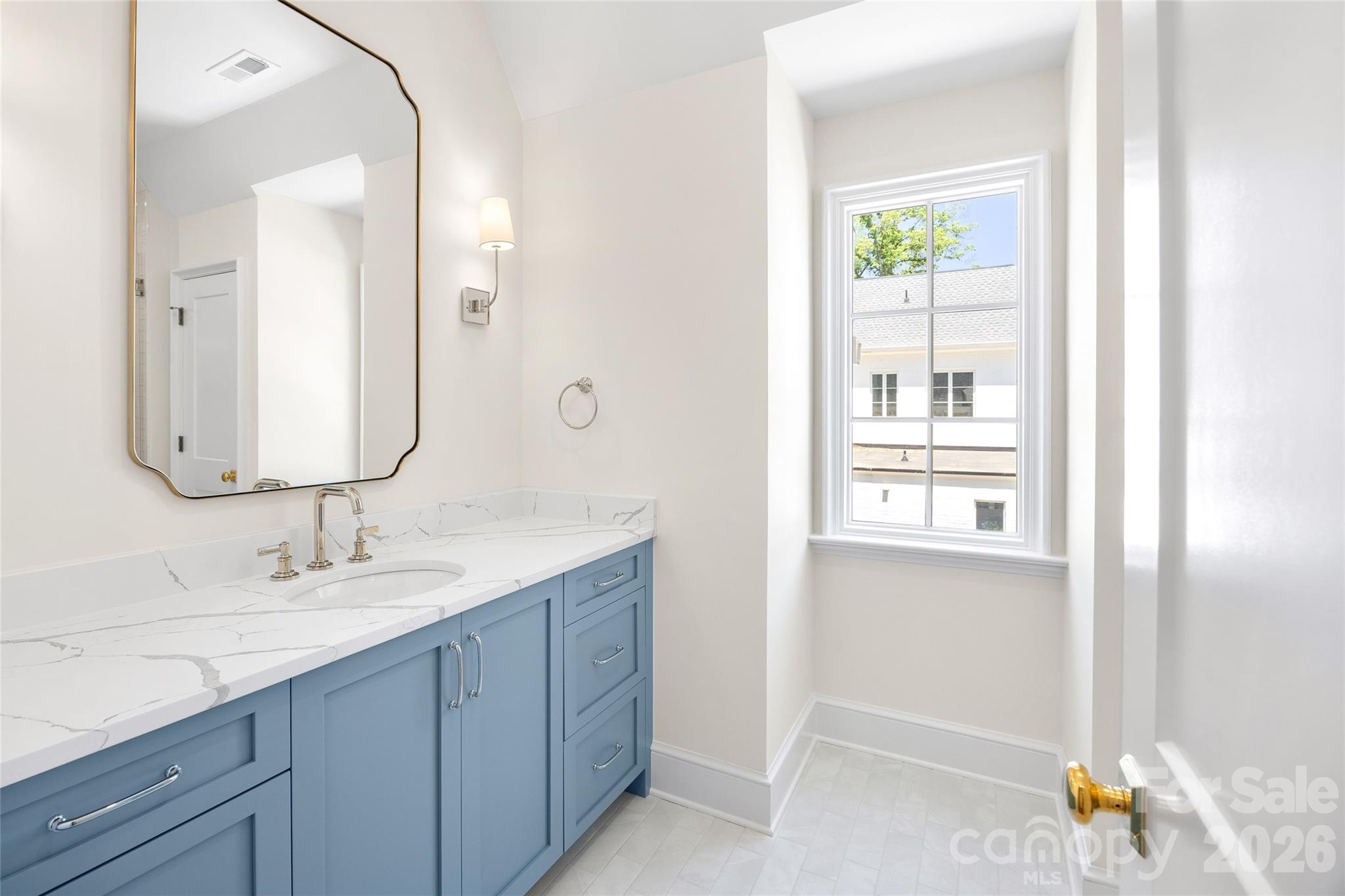1615 Coventry Road Charlotte, NC 28211 - Photo 38 of 48 a bathroom with a granite countertop sink and a mirror