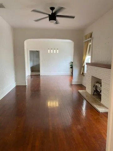 a view of a livingroom with wooden floor