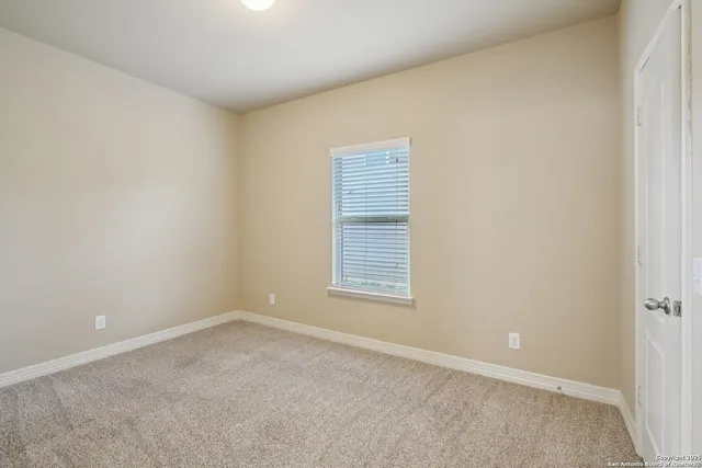 a bathroom with a granite countertop sink toilet a mirror and shower