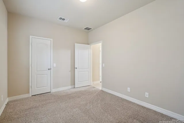 a view of a hallway with a room