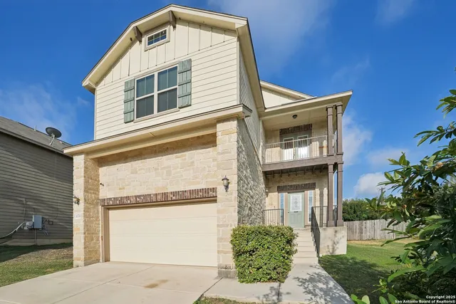 a front view of a house with a garage