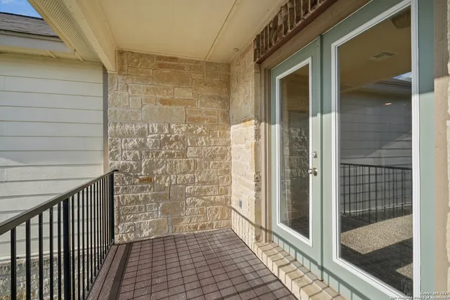 a view of a bathroom door with a glass door