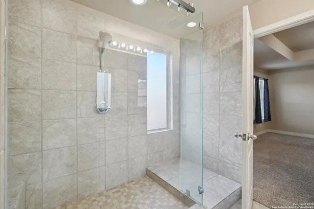 a view of a backyard with wooden fence