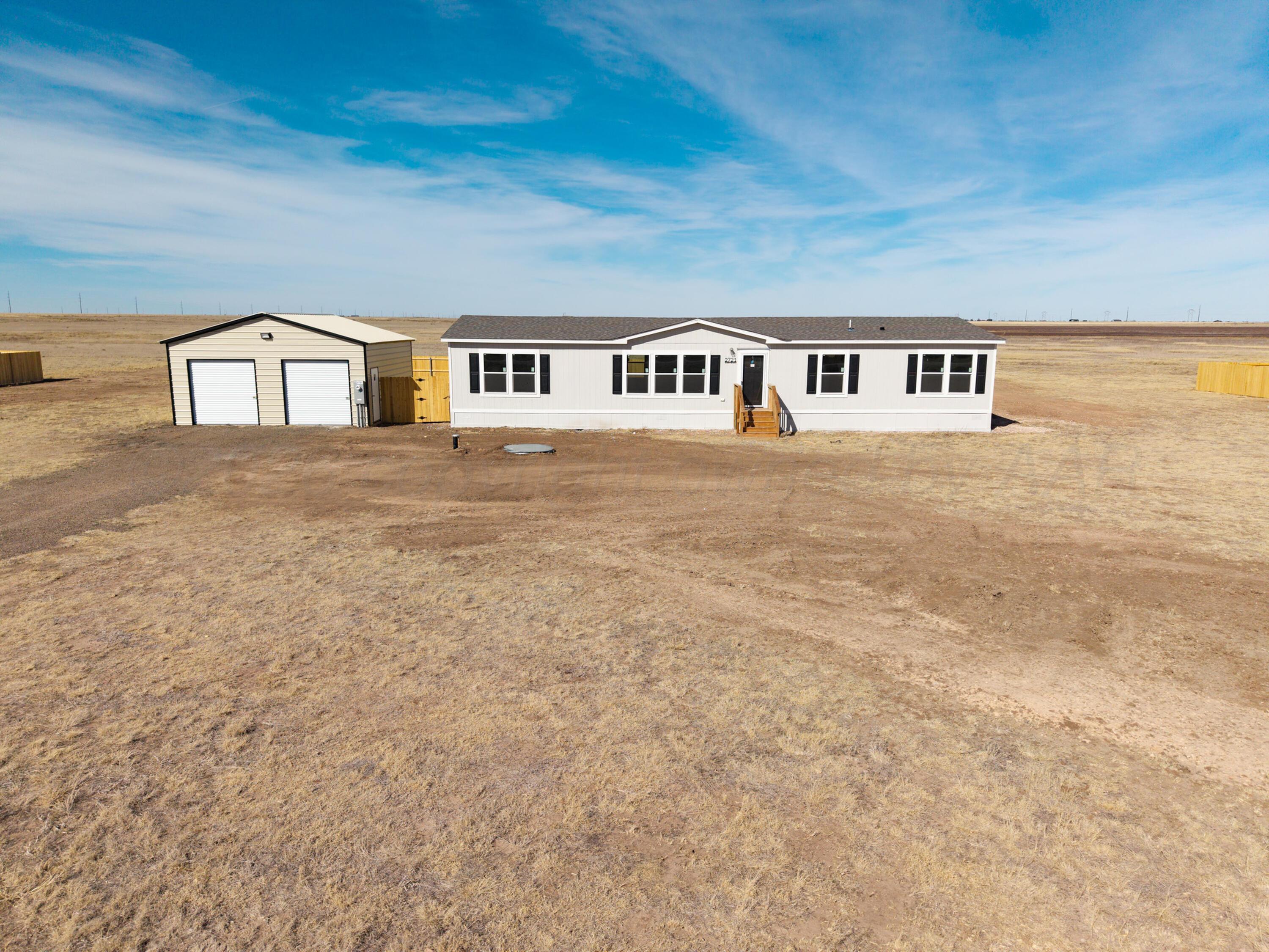 2721 Avery Rd Canyon Canyon, TX 79015 - Photo 2 of 30 a front view of a house with a garden and yard