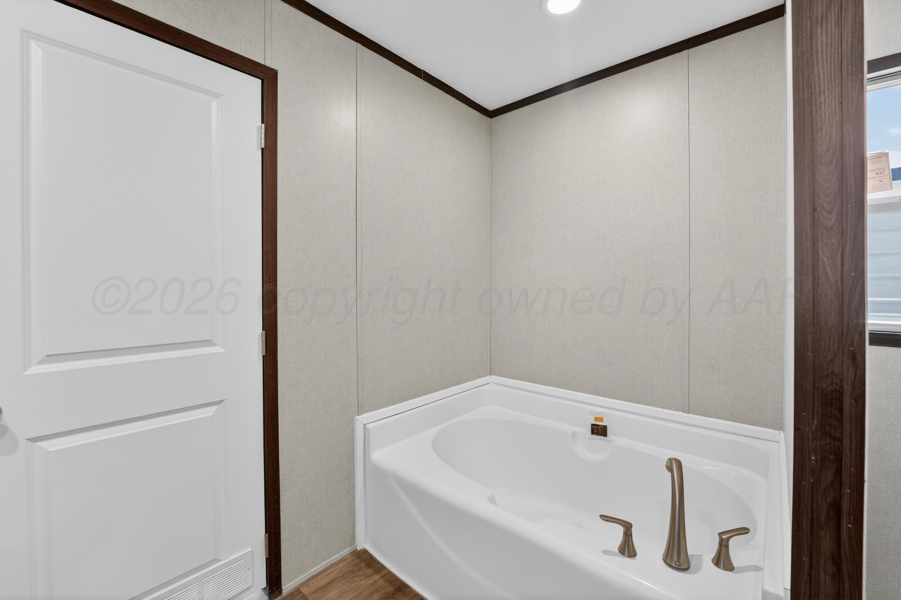 2721 Avery Rd Canyon Canyon, TX 79015 - Photo 22 of 30 a bathroom with a white bath tub