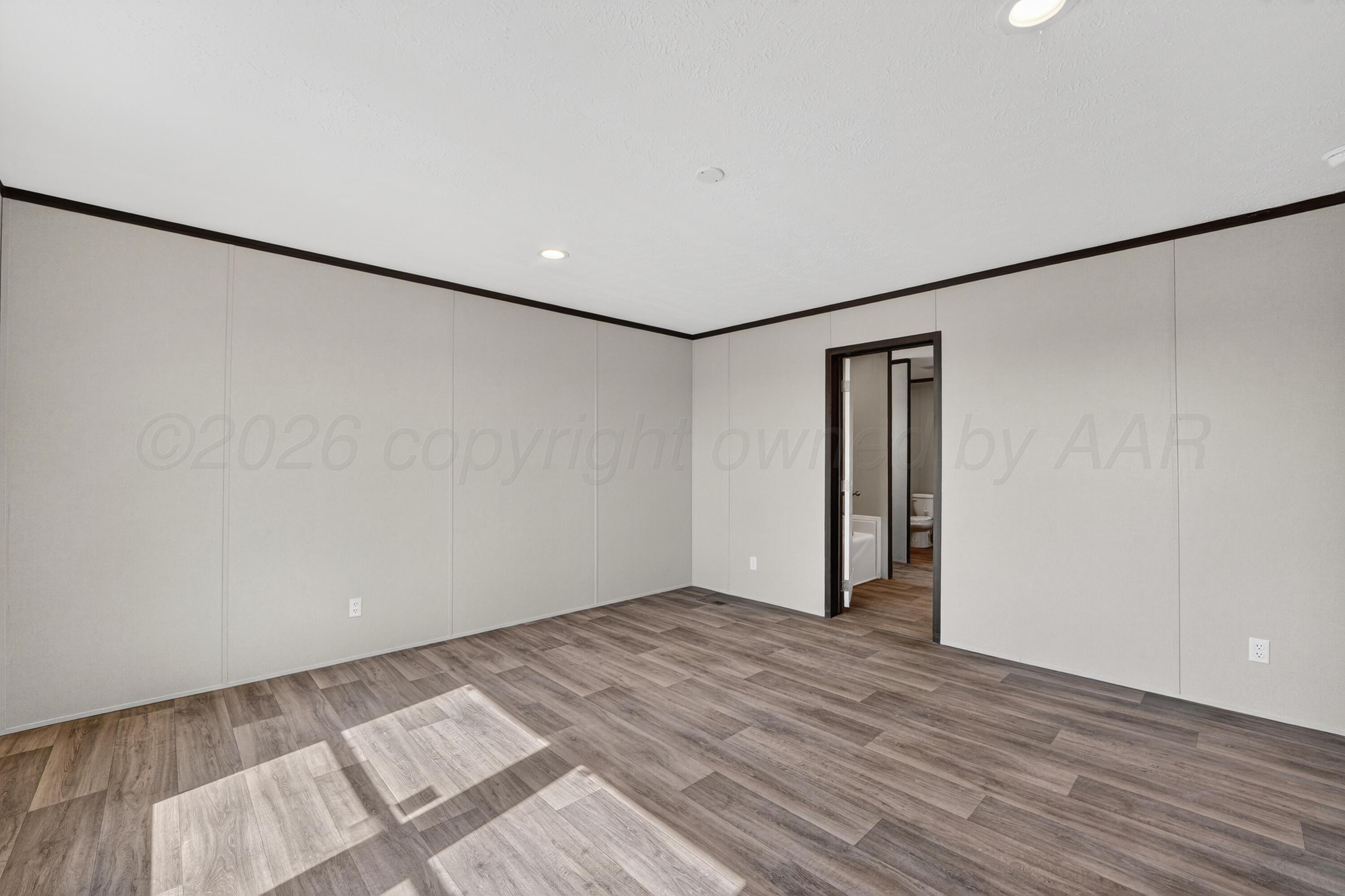 2721 Avery Rd Canyon Canyon, TX 79015 - Photo 24 of 30 a view of an empty room with wooden floor