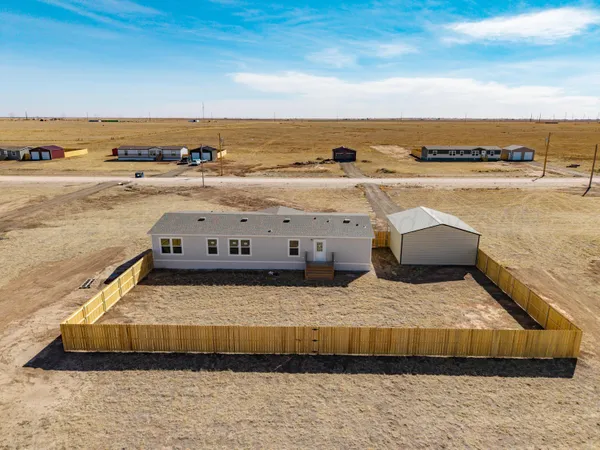 a picture of a room with a floor to ceiling window