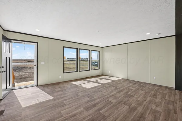 a view of an empty room with glass door