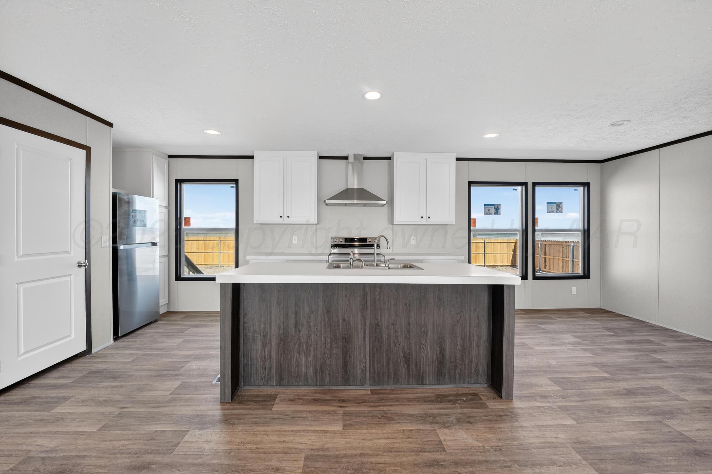 2721 Avery Rd Canyon Canyon, TX 79015 - Photo 7 of 30 a living room with stainless steel appliances kitchen island granite countertop a stove and a sink