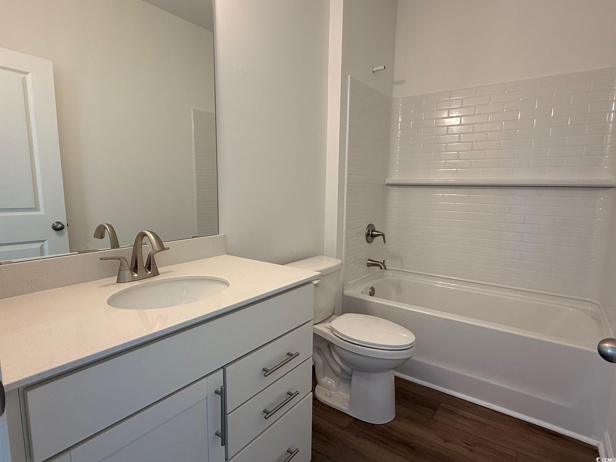 112 Cascade Drive Conway, SC 29527 - Photo 11 of 13 Bathroom with shower / tub combination, vanity, and dark wood-style flooring