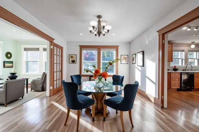 a view of a dining room with furniture window and wooden floor