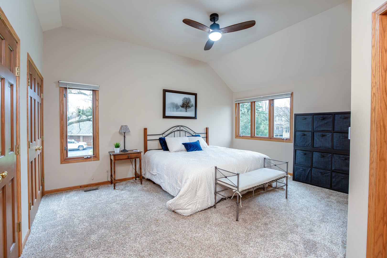 29W220 Oak Knoll Road West Chicago, IL 60185 - Photo 12 of 24 a spacious bedroom with a bed a dresser and a window