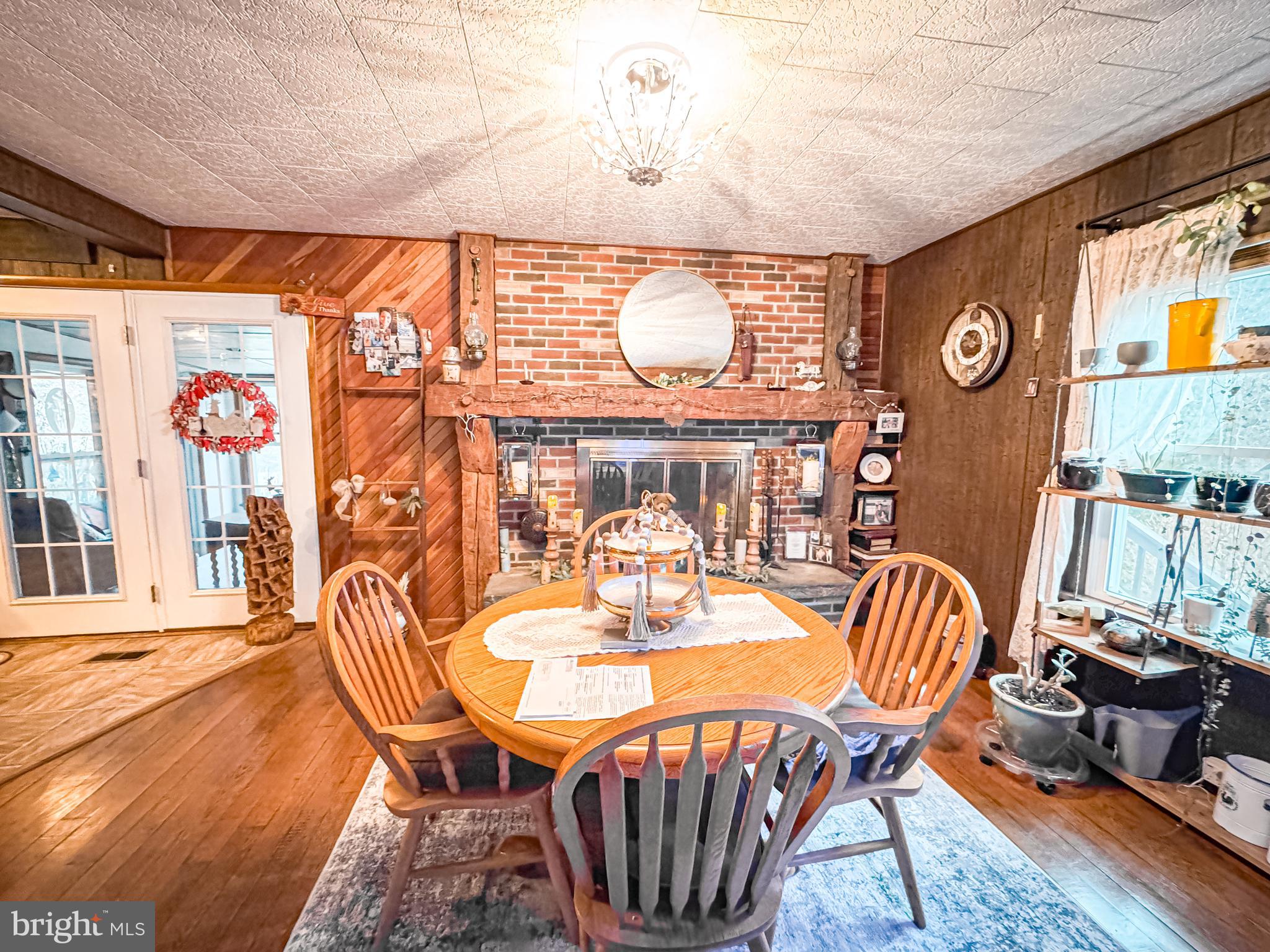 12522 Bakers Hollow Road Hesston, PA 16647 - Photo 11 of 72 a dining room with furniture and wooden floor