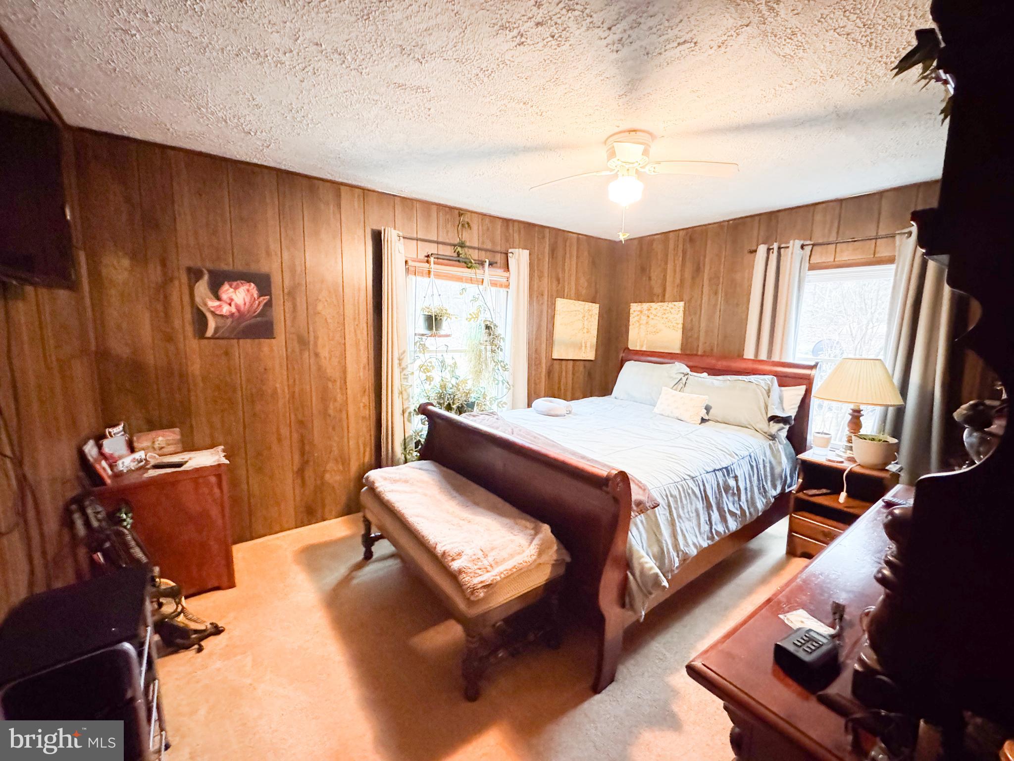 12522 Bakers Hollow Road Hesston, PA 16647 - Photo 17 of 72 a bedroom with a bed couch and window