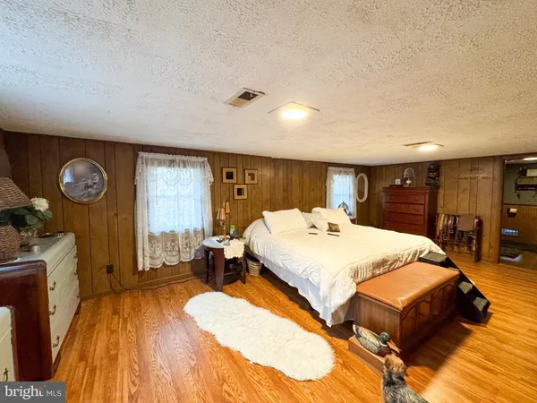 a bed room with a bed and a couch