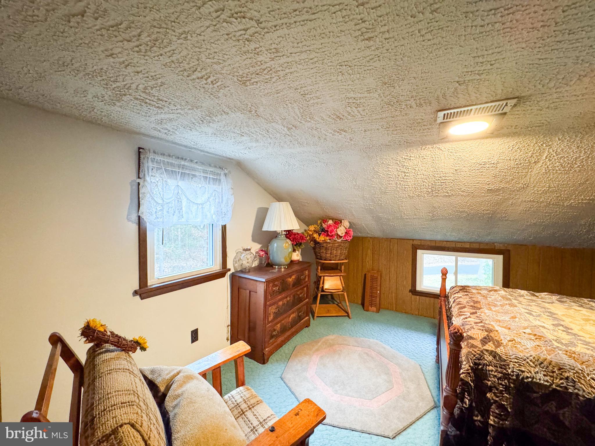 12522 Bakers Hollow Road Hesston, PA 16647 - Photo 27 of 72 a bed room with a bed and a couch