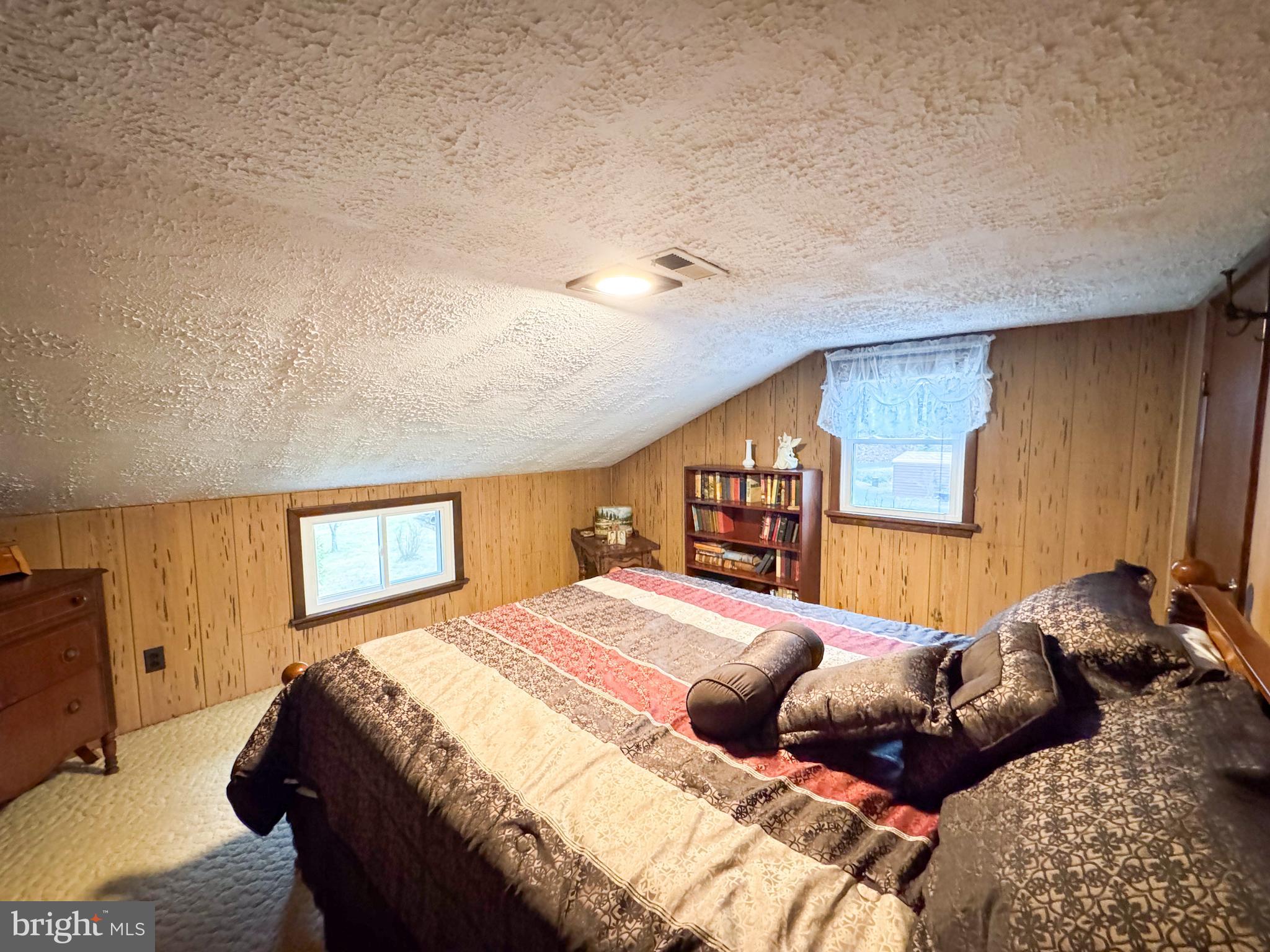 12522 Bakers Hollow Road Hesston, PA 16647 - Photo 28 of 72 a bedroom with a large bed and a window