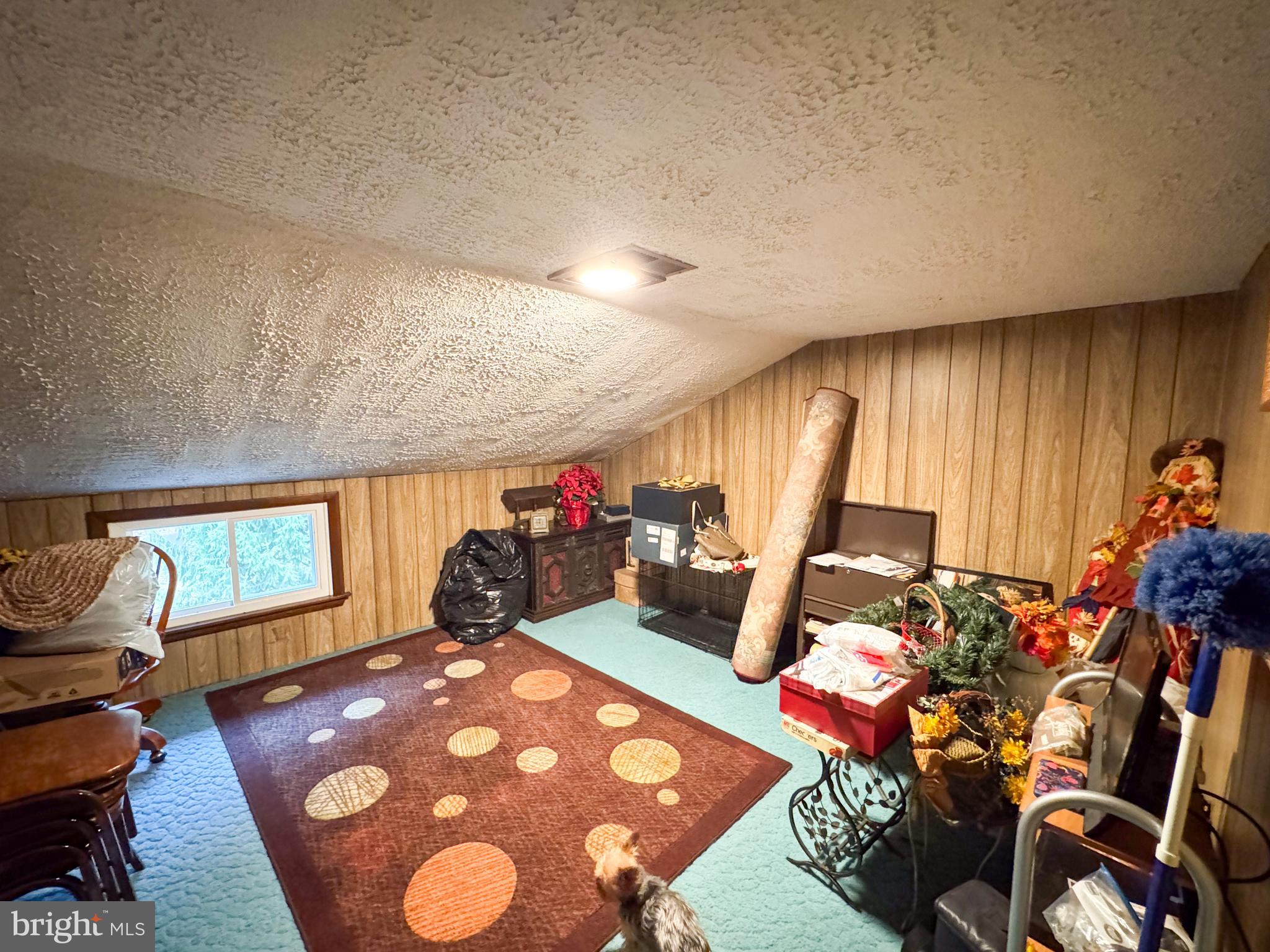 12522 Bakers Hollow Road Hesston, PA 16647 - Photo 29 of 72 a room with furniture a rug and a window