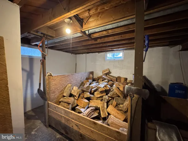 a living room with furniture a rug and a flat screen tv