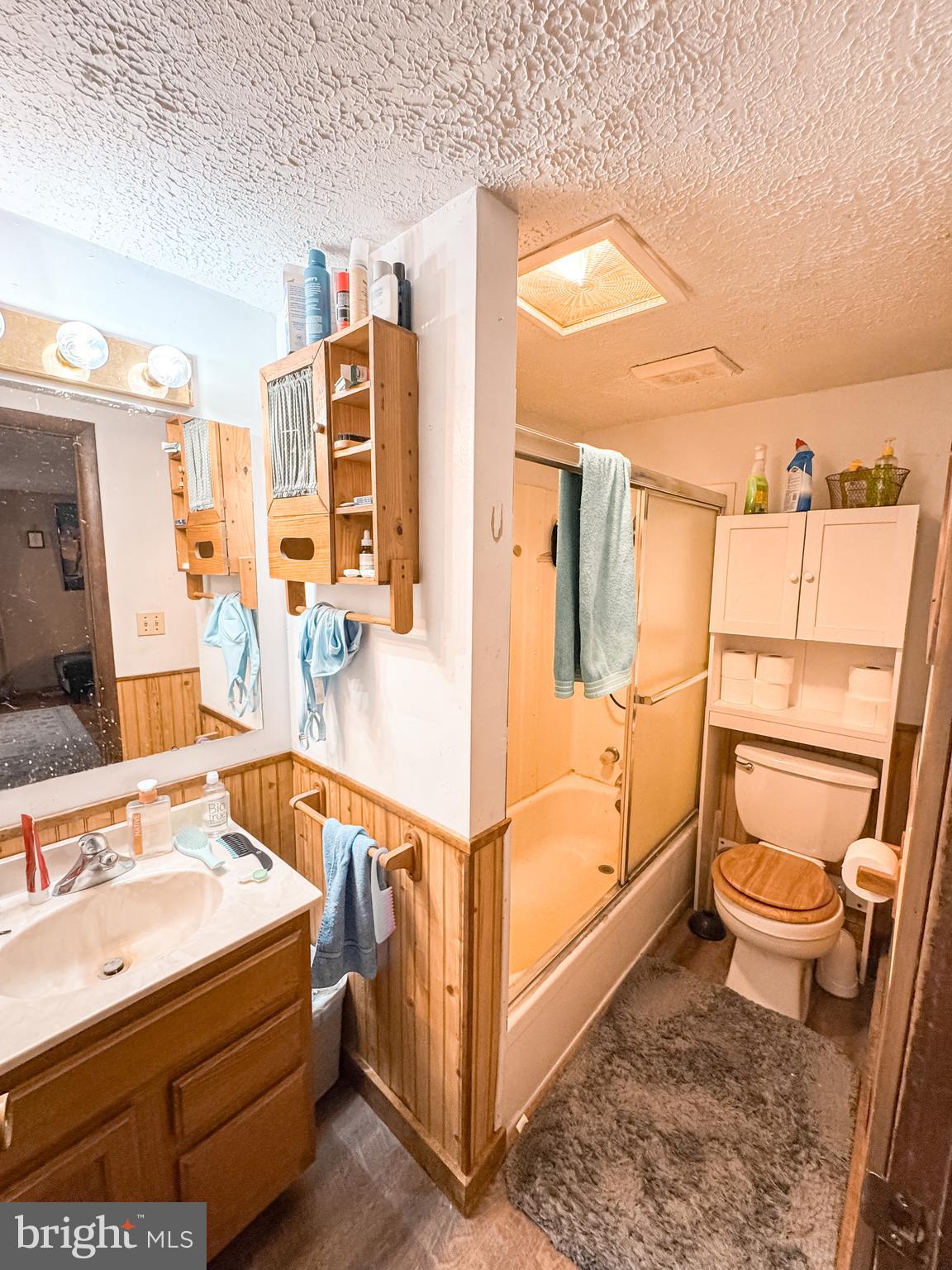 12522 Bakers Hollow Road Hesston, PA 16647 - Photo 49 of 72 a bathroom with a sink mirror vanity and toilet
