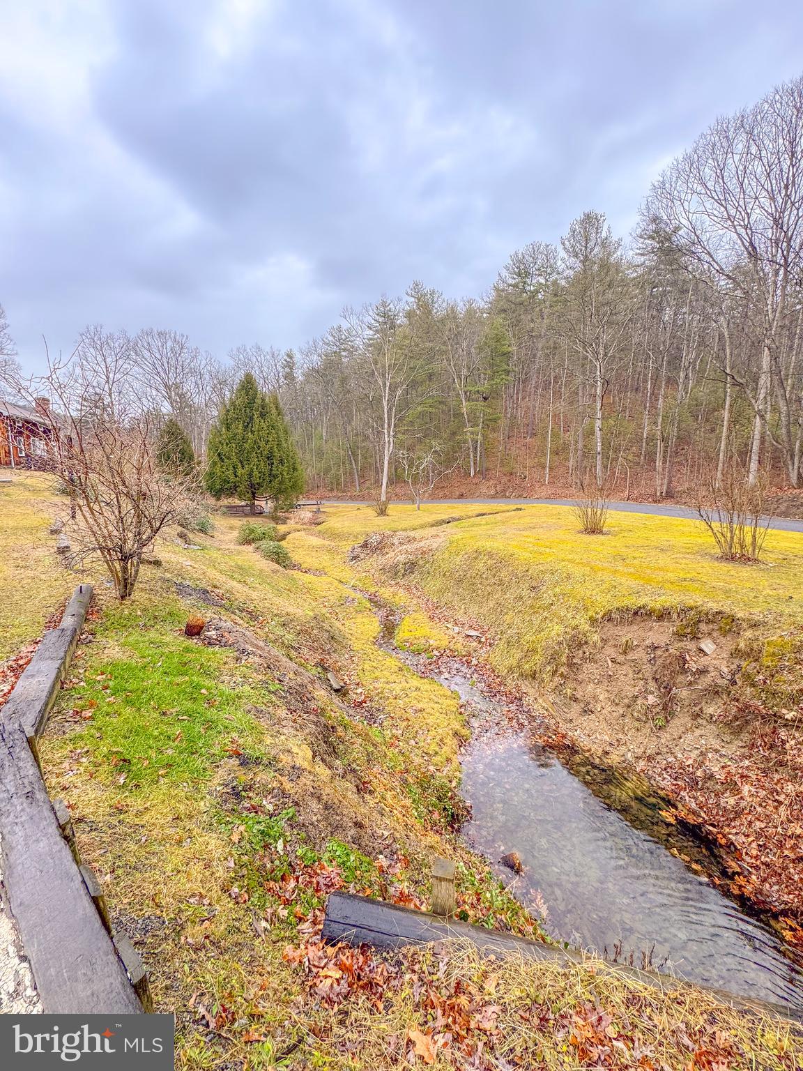 12522 Bakers Hollow Road Hesston, PA 16647 - Photo 68 of 72 a view of a yard with an empty space and wooden fence