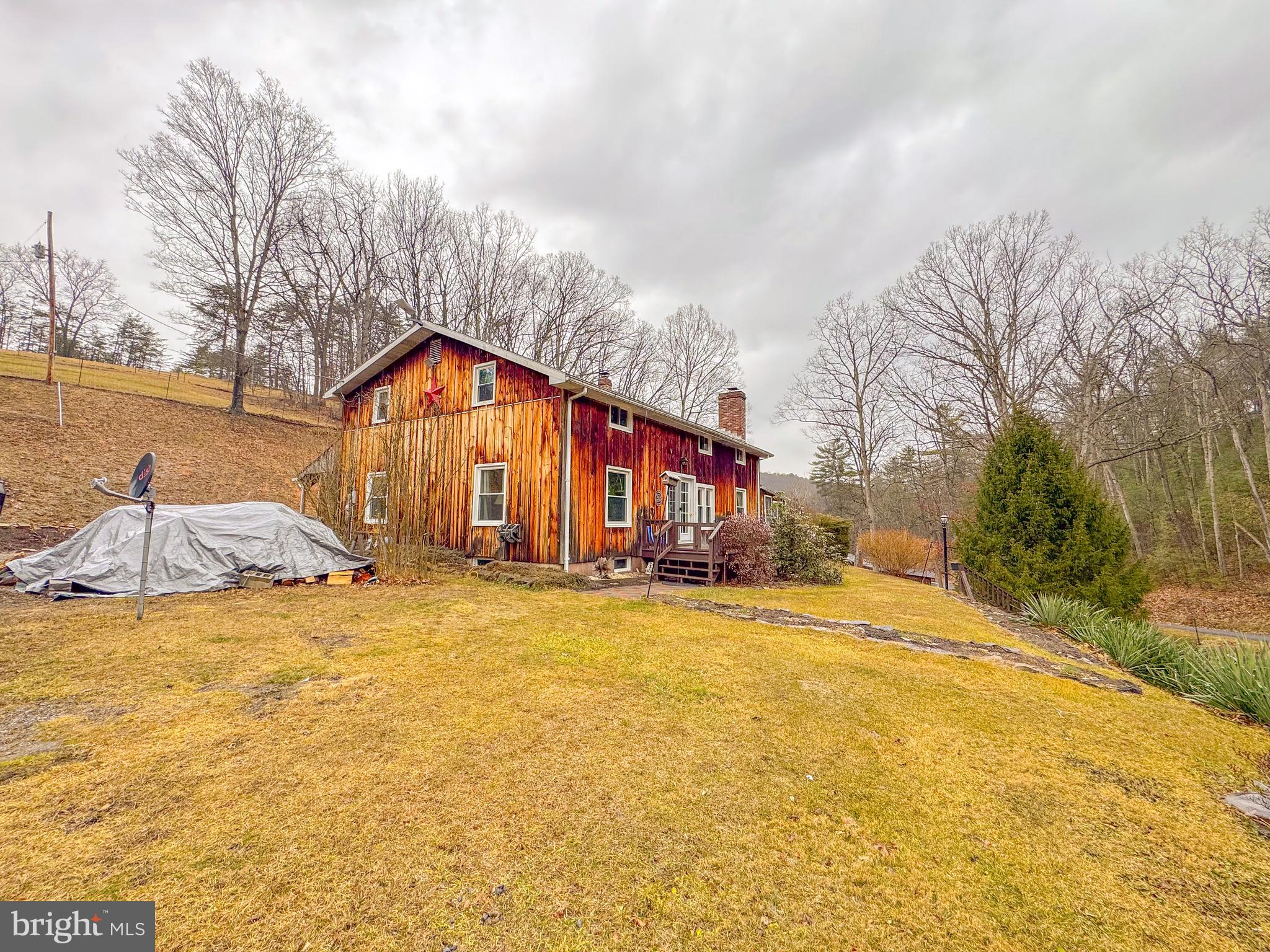 12522 Bakers Hollow Road Hesston, PA 16647 - Photo 70 of 72 a front view of house with yard and ocean