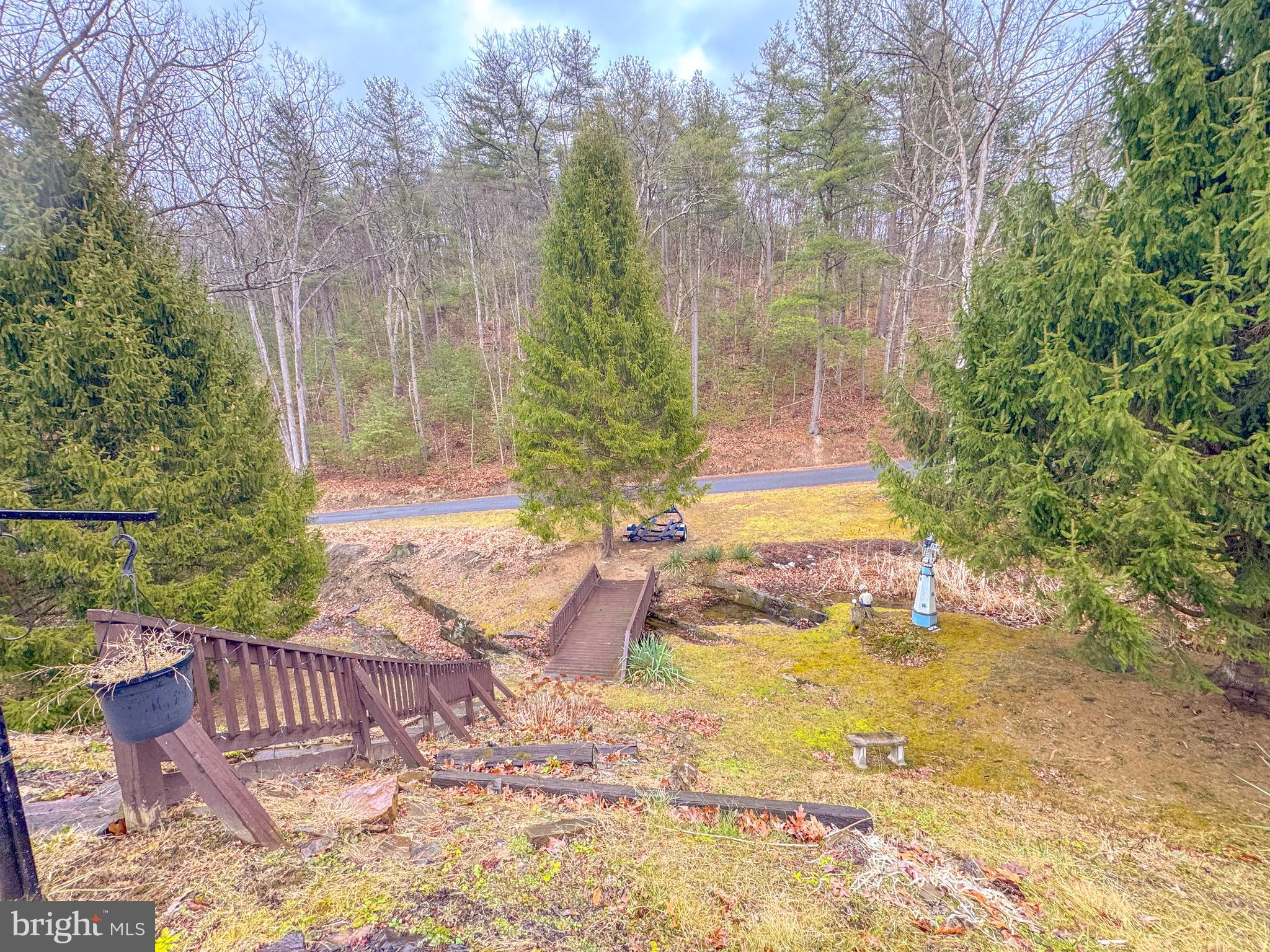 12522 Bakers Hollow Road Hesston, PA 16647 - Photo 71 of 72 a view of a patio with table and chairs and wooden fence