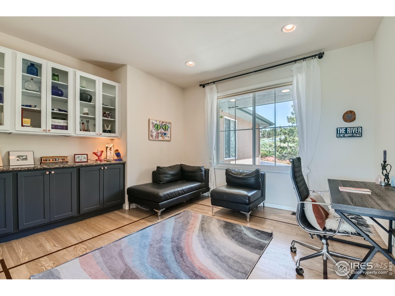365 Vasquez Court Lyons, CO 80540 - Photo 11 of 40 a living room with furniture and a window