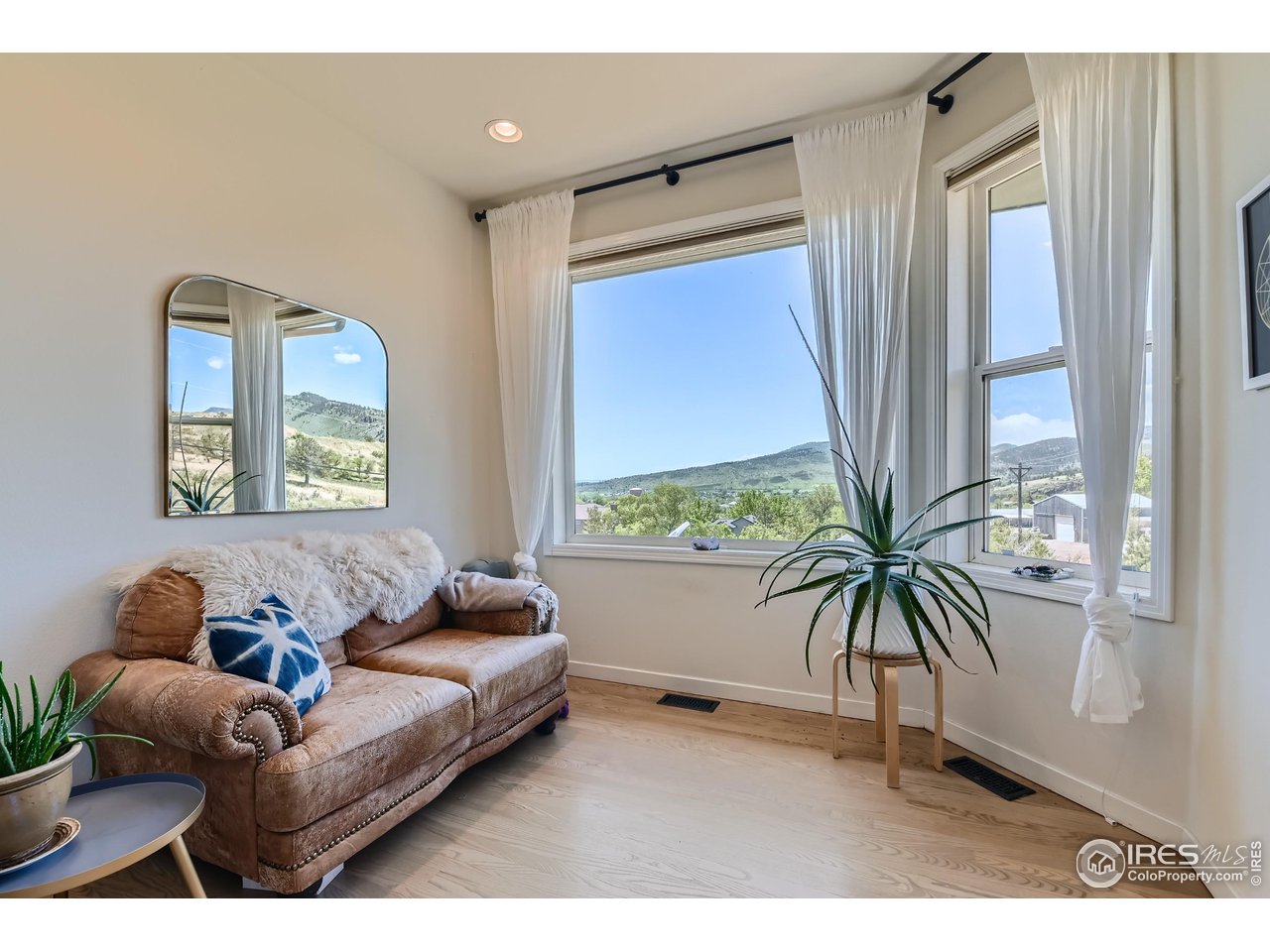 365 Vasquez Court Lyons, CO 80540 - Photo 13 of 40 a living room with furniture and a large window
