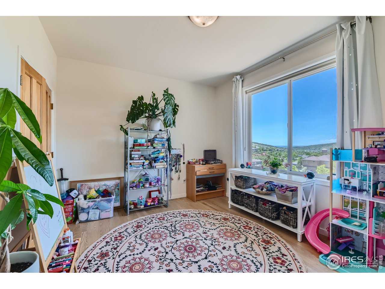 365 Vasquez Court Lyons, CO 80540 - Photo 19 of 40 a bedroom with furniture and a window