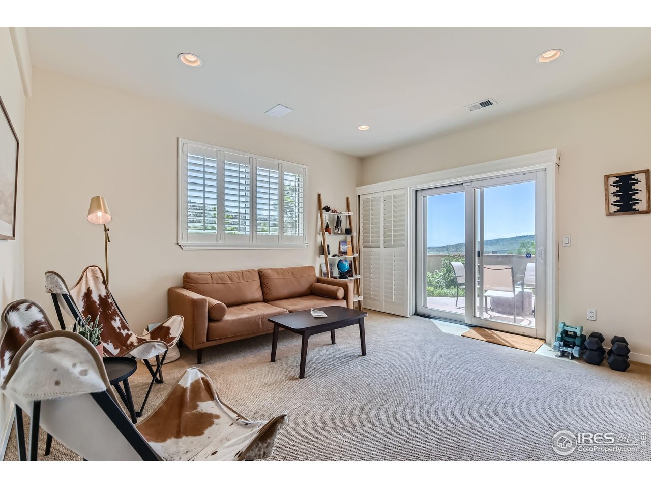 365 Vasquez Court Lyons, CO 80540 - Photo 21 of 40 a living room with furniture and a large window