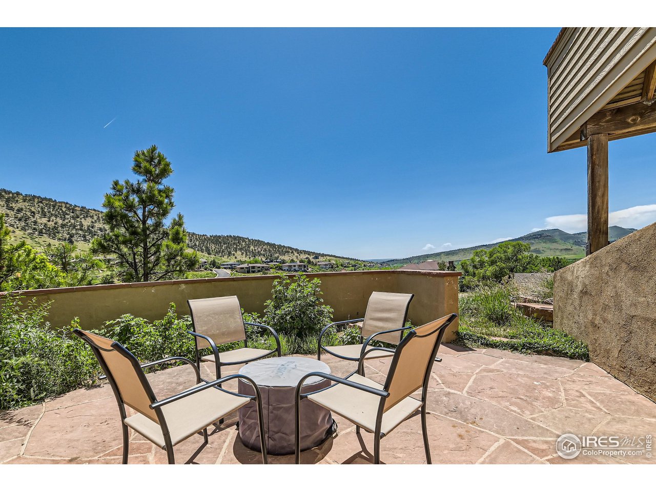 365 Vasquez Court Lyons, CO 80540 - Photo 22 of 40 a view of a chairs and table in the patio
