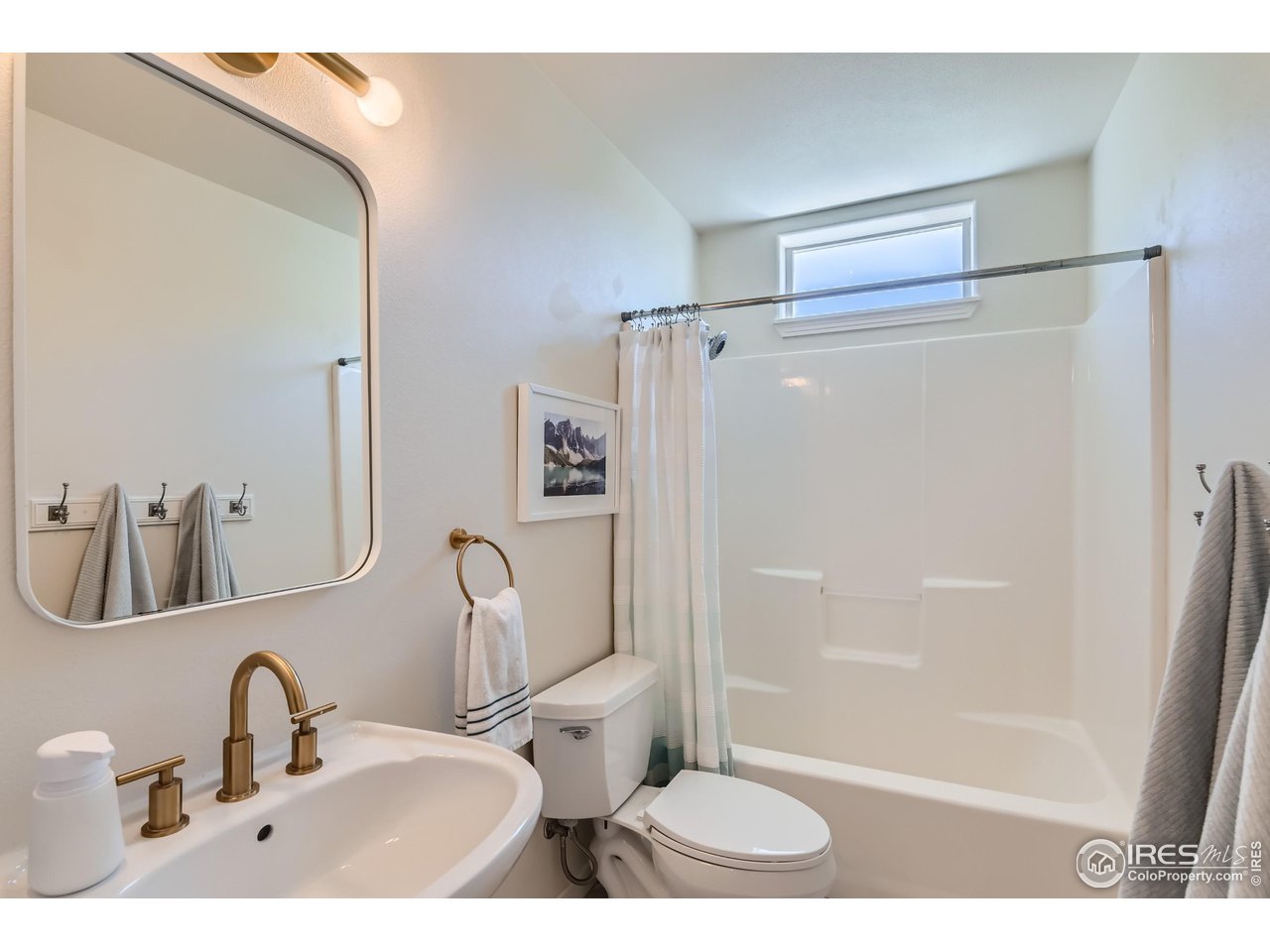 365 Vasquez Court Lyons, CO 80540 - Photo 25 of 40 a bathroom with a sink and a mirror