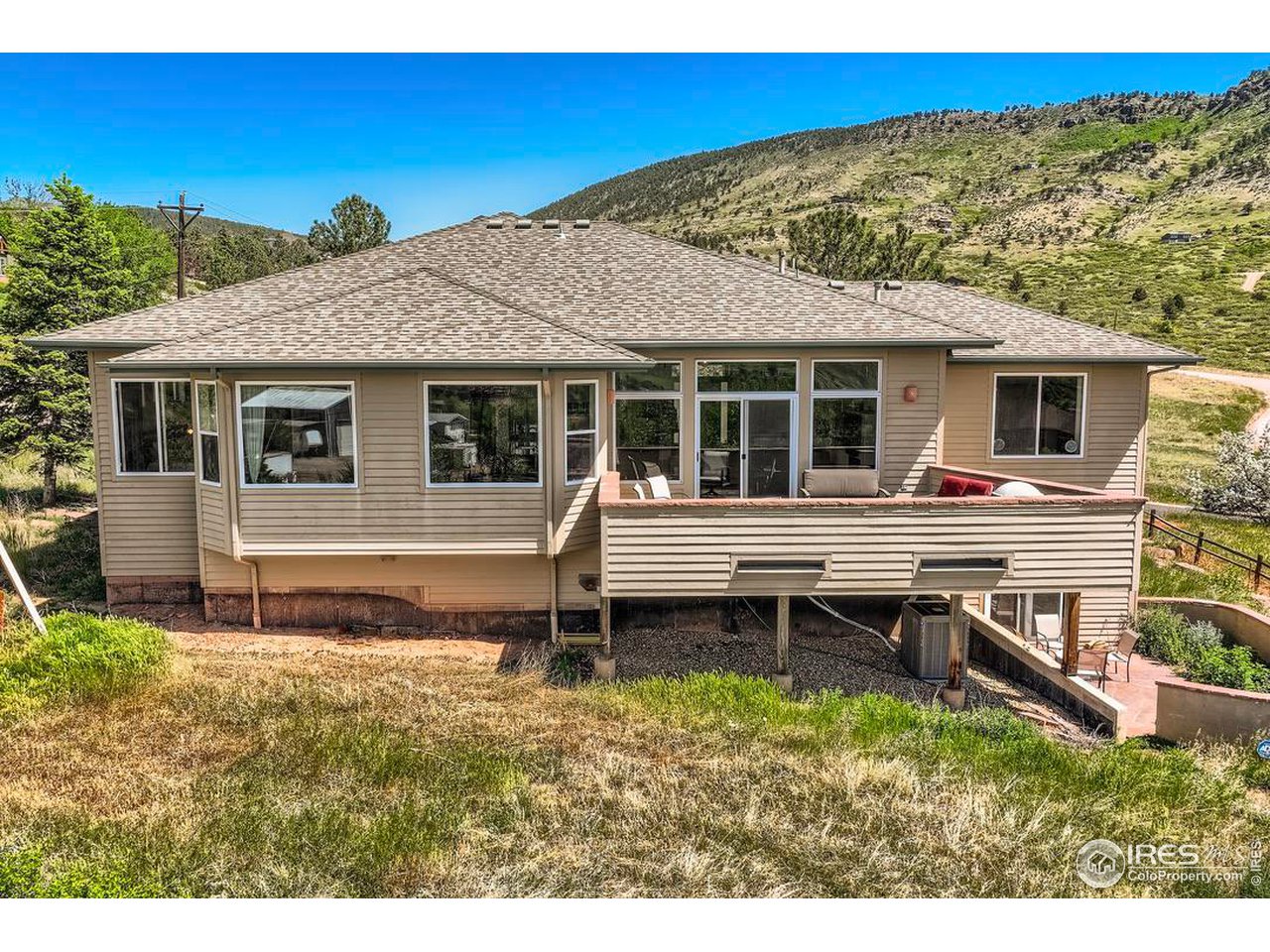 365 Vasquez Court Lyons, CO 80540 - Photo 26 of 40 a house view with a backyard space