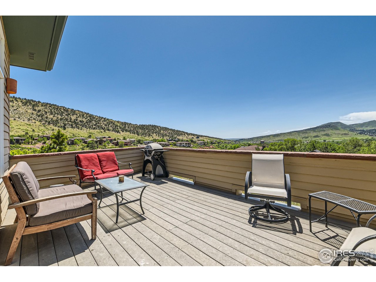 365 Vasquez Court Lyons, CO 80540 - Photo 27 of 40 a terrace with outdoor seating and city view