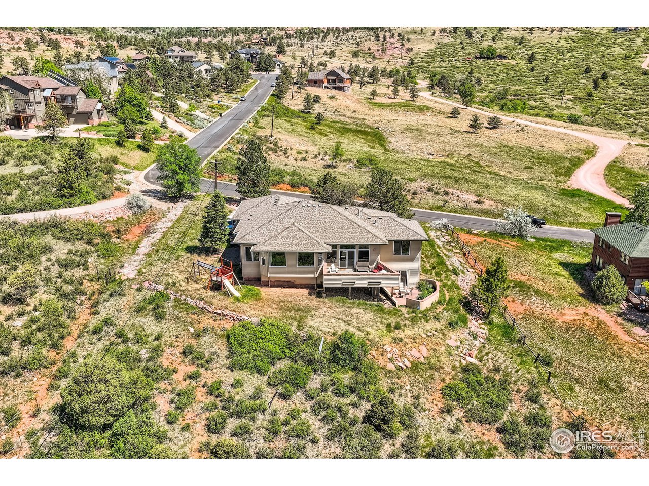365 Vasquez Court Lyons, CO 80540 - Photo 31 of 40 a view of a house with a yard