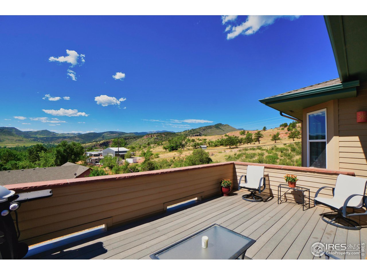 365 Vasquez Court Lyons, CO 80540 - Photo 6 of 40 a view of a balcony with chair and table