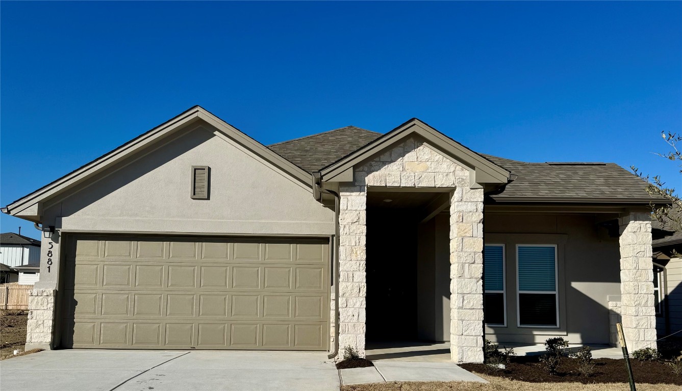5881 Marsh Lane Buda, TX 78610 - Photo 1 of 1 a front view of a house with garage