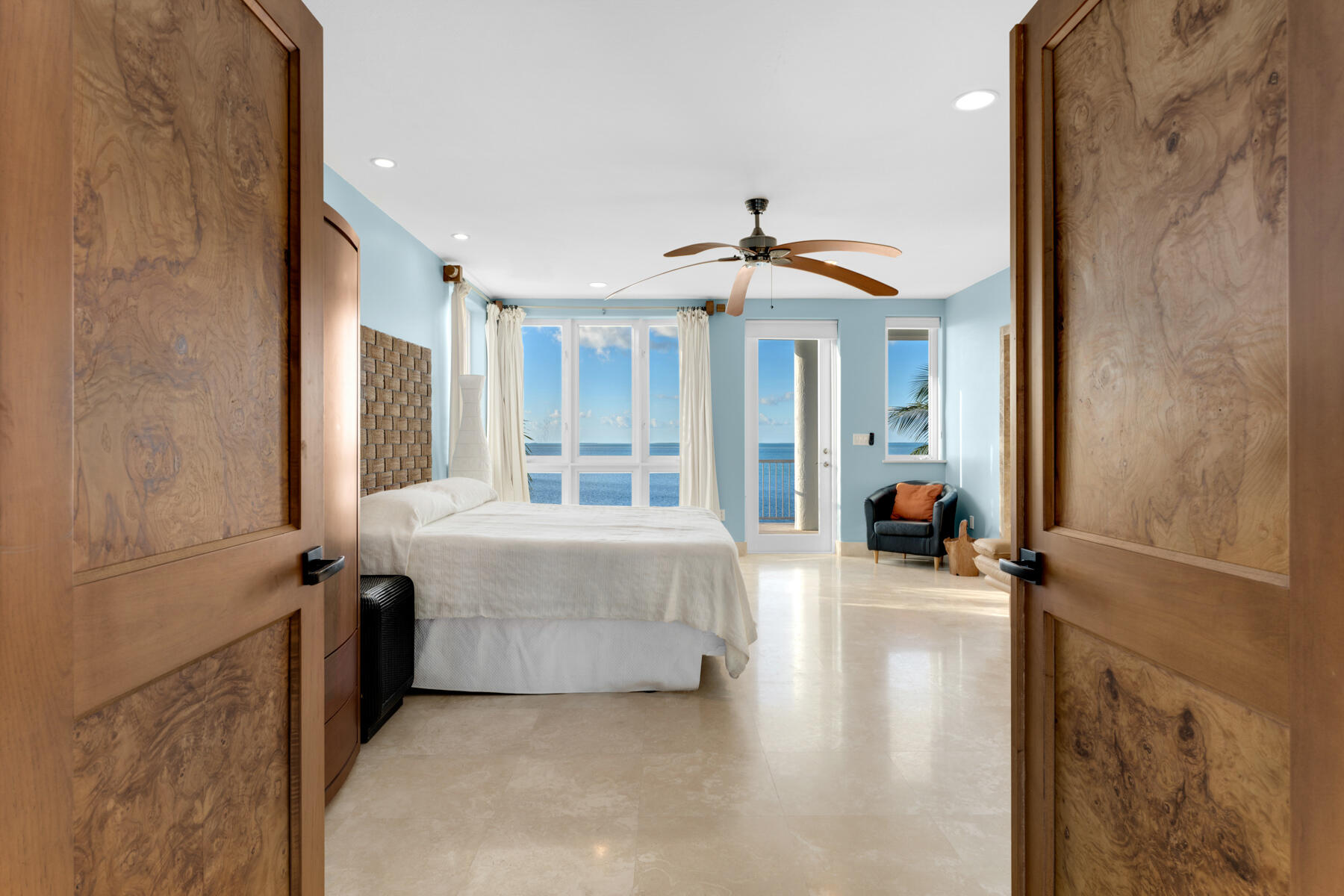 144 North Rolling Hill Road Tavernier, FL 33070 - Photo 19 of 80 a spacious bedroom with a bed and a chandelier