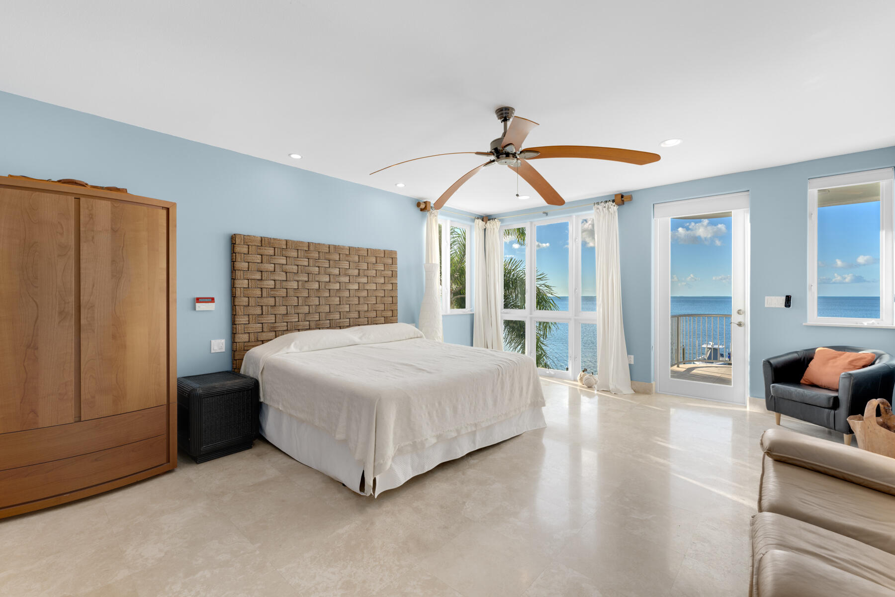 144 North Rolling Hill Road Tavernier, FL 33070 - Photo 20 of 80 a bedroom with a bed a couch and a chandelier