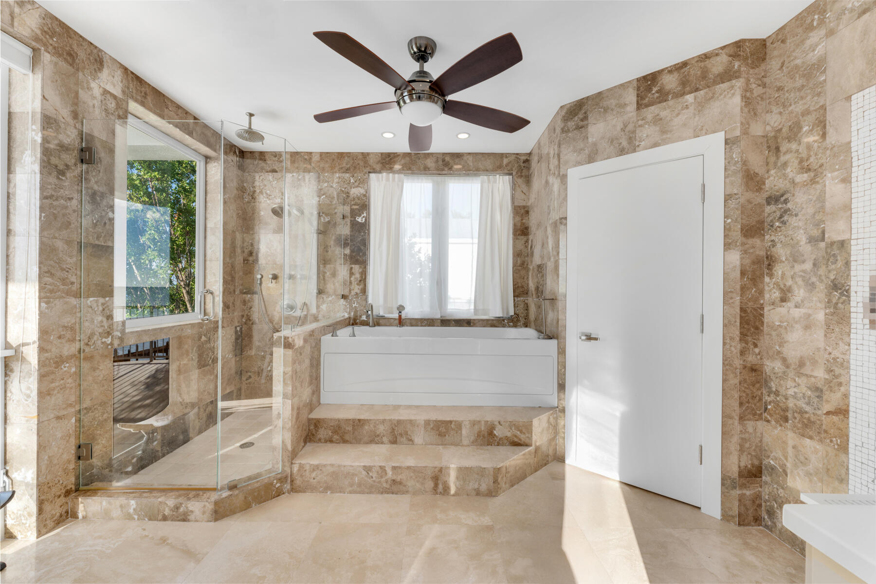 144 North Rolling Hill Road Tavernier, FL 33070 - Photo 22 of 80 a living room with a large window and chandelier