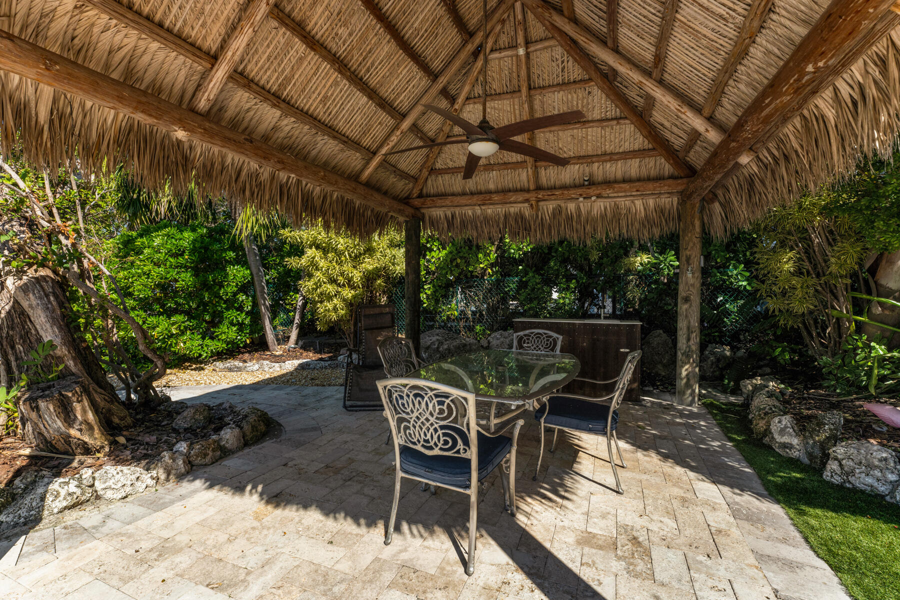 144 North Rolling Hill Road Tavernier, FL 33070 - Photo 35 of 80 a patio with a yard table and chairs
