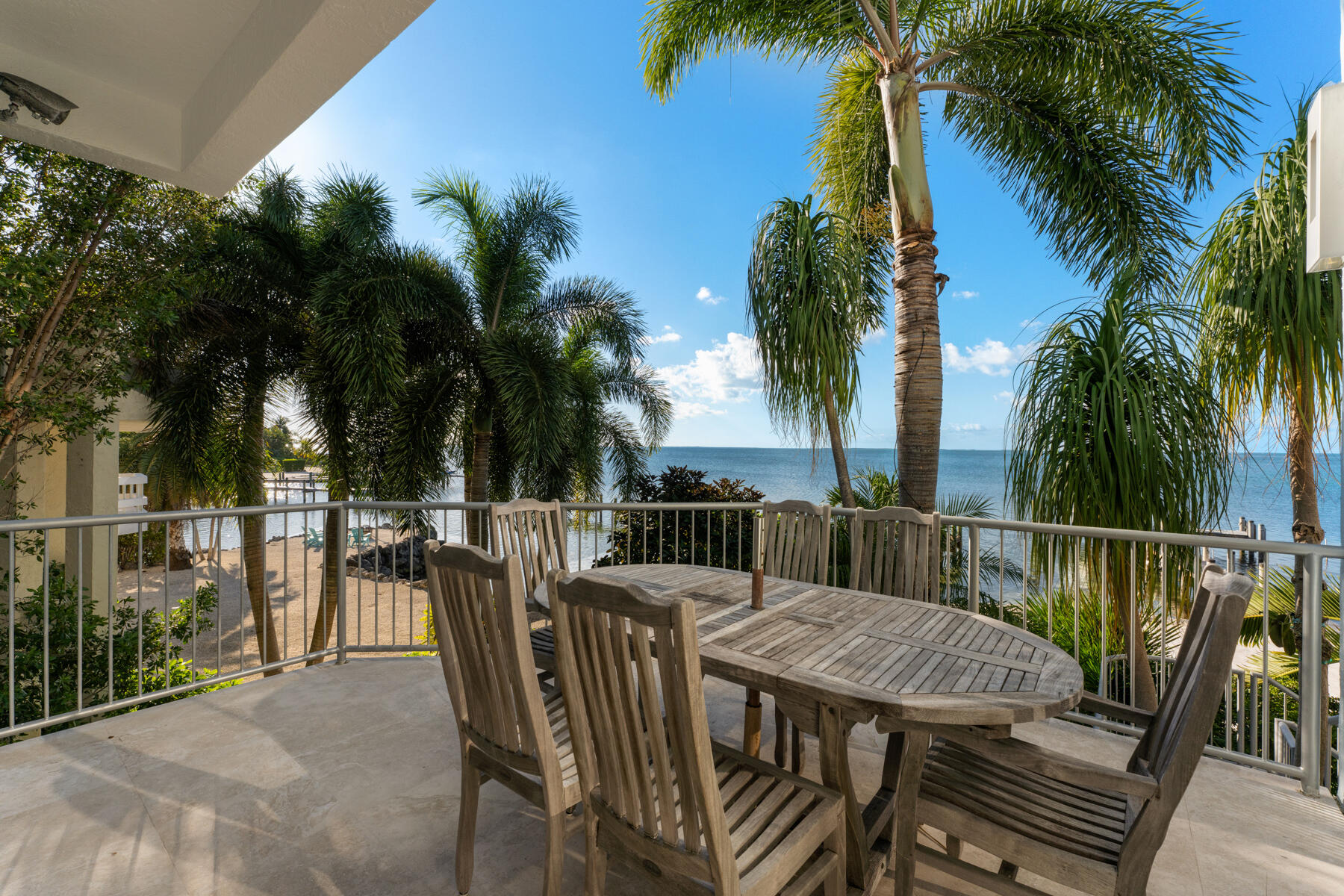144 North Rolling Hill Road Tavernier, FL 33070 - Photo 41 of 80 a view of a roof deck with palm trees