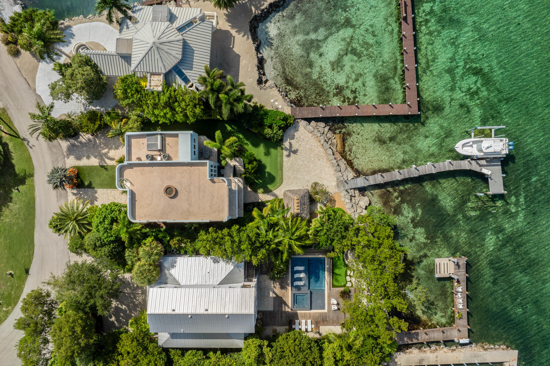 144 North Rolling Hill Road Tavernier, FL 33070 - Photo 52 of 80 an aerial view of a house with a garden and a yard