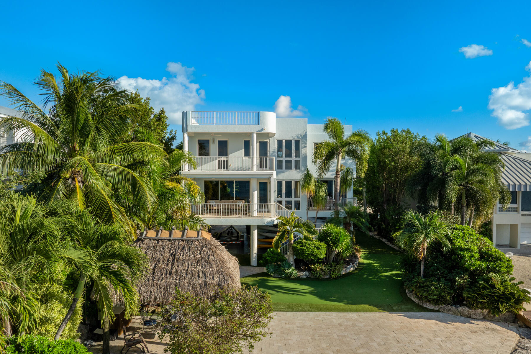 144 North Rolling Hill Road Tavernier, FL 33070 - Photo 53 of 80 a view of a house with a garden