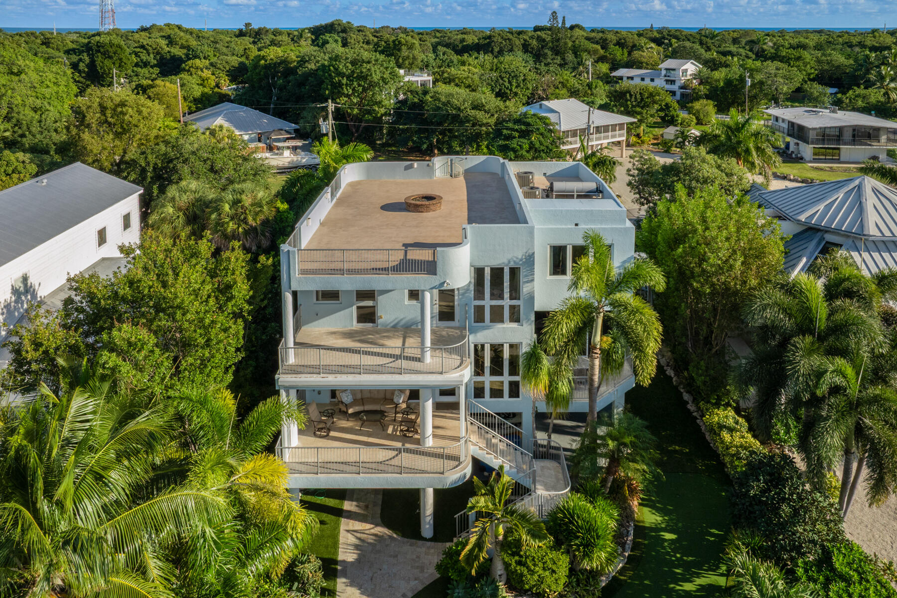 144 North Rolling Hill Road Tavernier, FL 33070 - Photo 55 of 80 an aerial view of multiple houses with a yard
