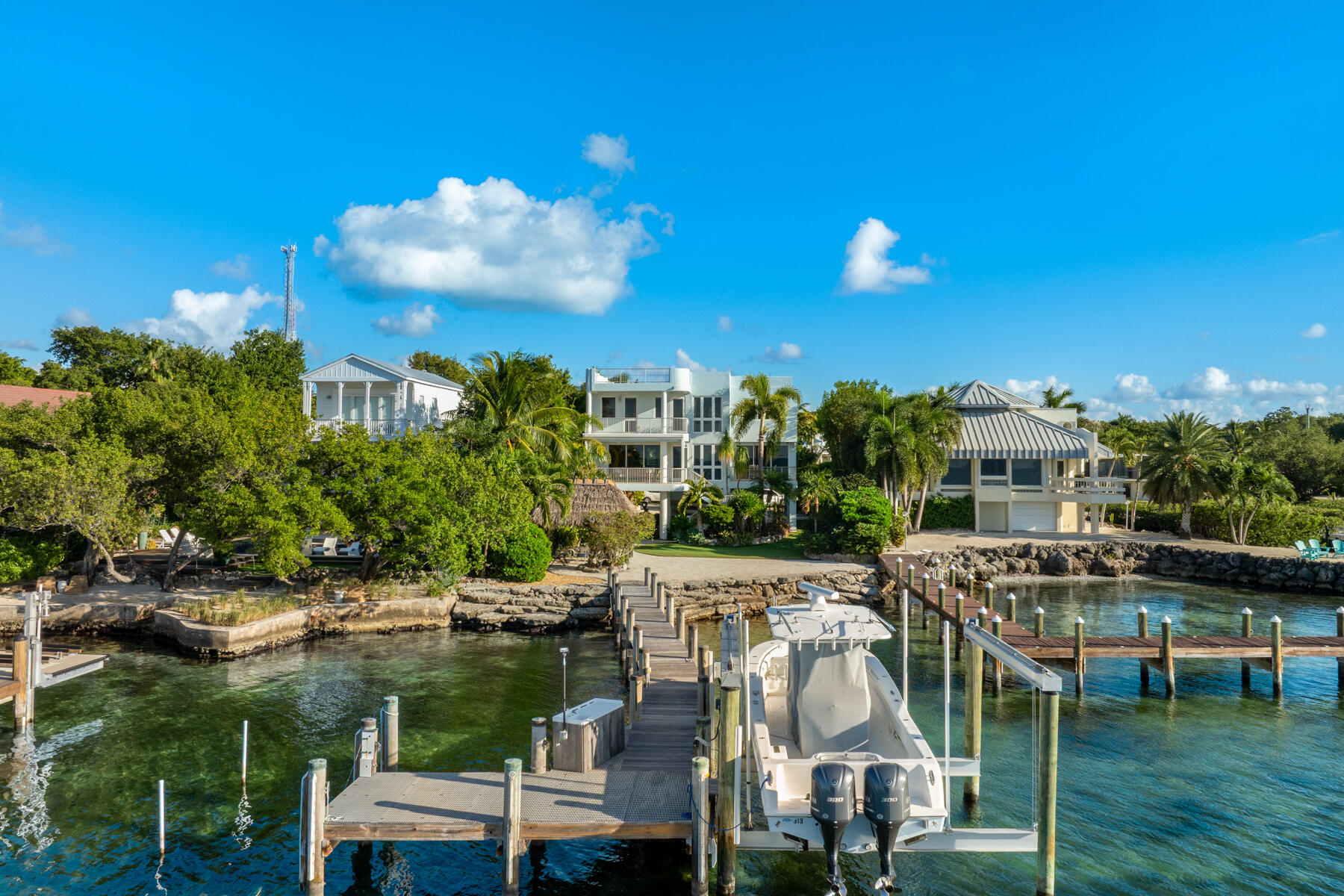 144 North Rolling Hill Road Tavernier, FL 33070 - Photo 57 of 80 a view of a lake with couches and city view