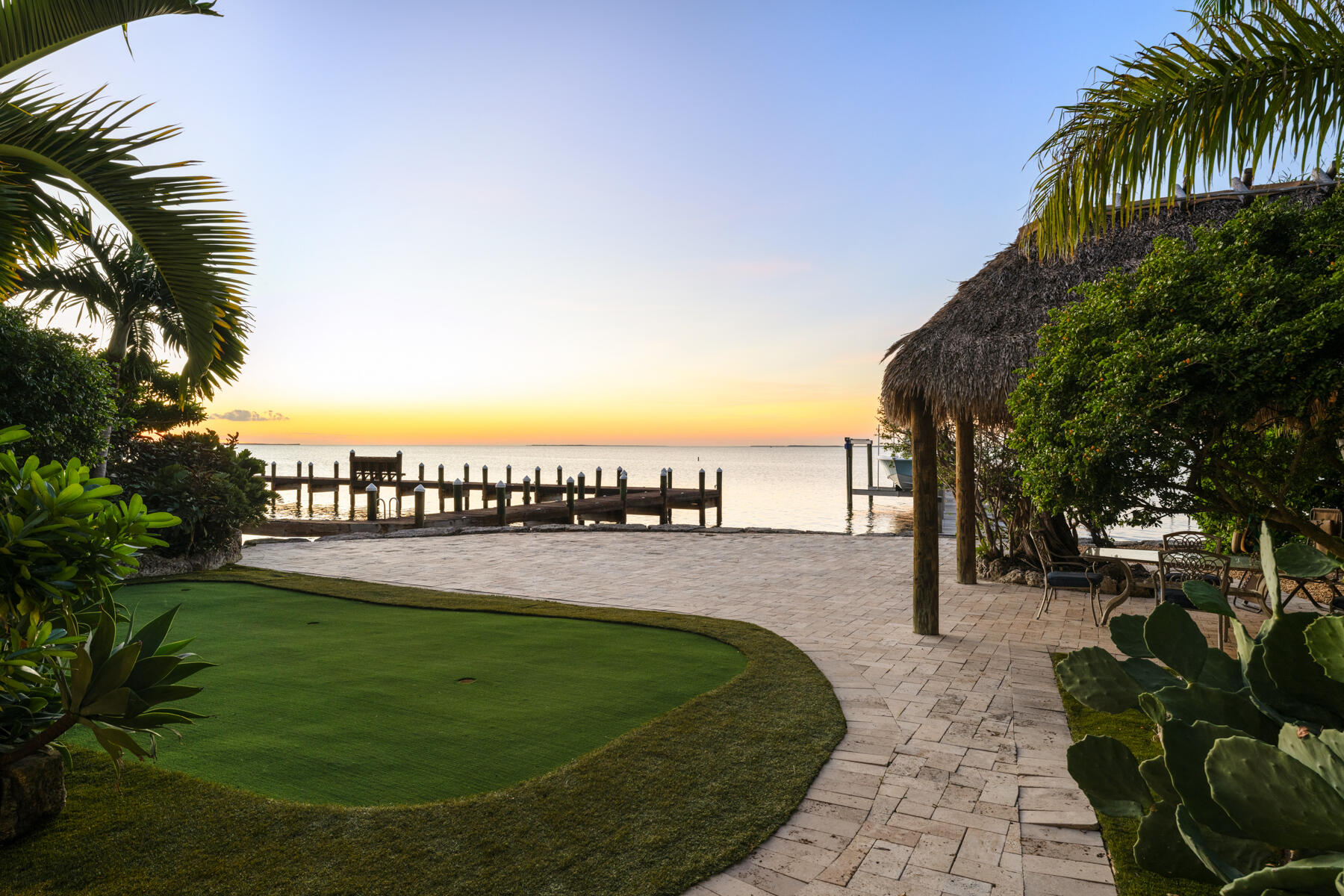 144 North Rolling Hill Road Tavernier, FL 33070 - Photo 62 of 80 a view of a lake with a garden