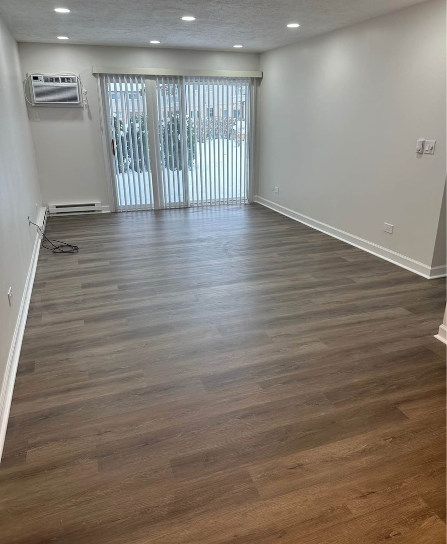 880 East Old Willow Road, Unit 175 Prospect Heights, IL 60070 - Photo 2 of 10 a view of an empty room with wooden floor